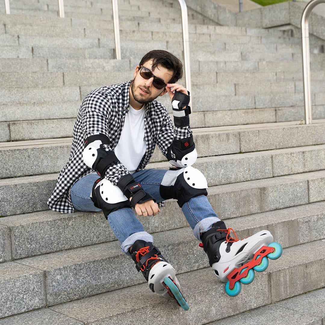 Inline skater resting on concrete steps in the full SKATEWIZ set